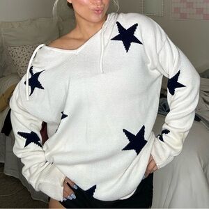 Striped sweater with hoodie! I like to wear off the shoulder over a swimsuit :)